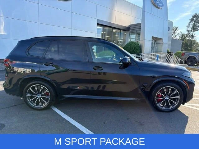 Used 2024 Carbon Black Metallic BMW xDrive50e image 2