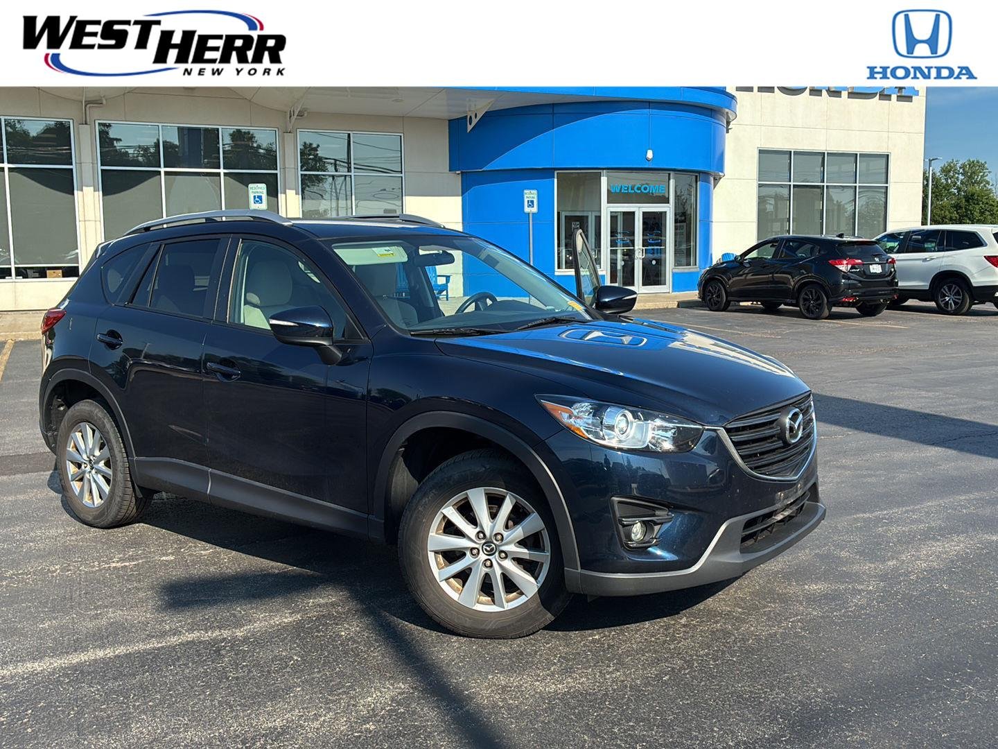 Used 2016 Deep Crystal Blue Mica Mazda Touring image 1