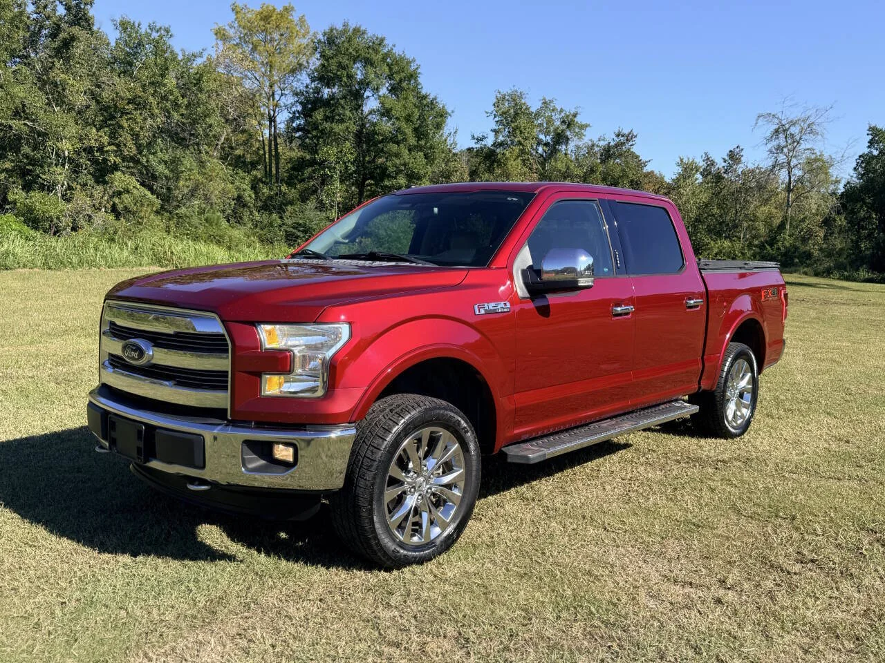 Used 2016 Red Ford Lariat 4x4 4dr SuperCrew 5.5 ft. SB image 1