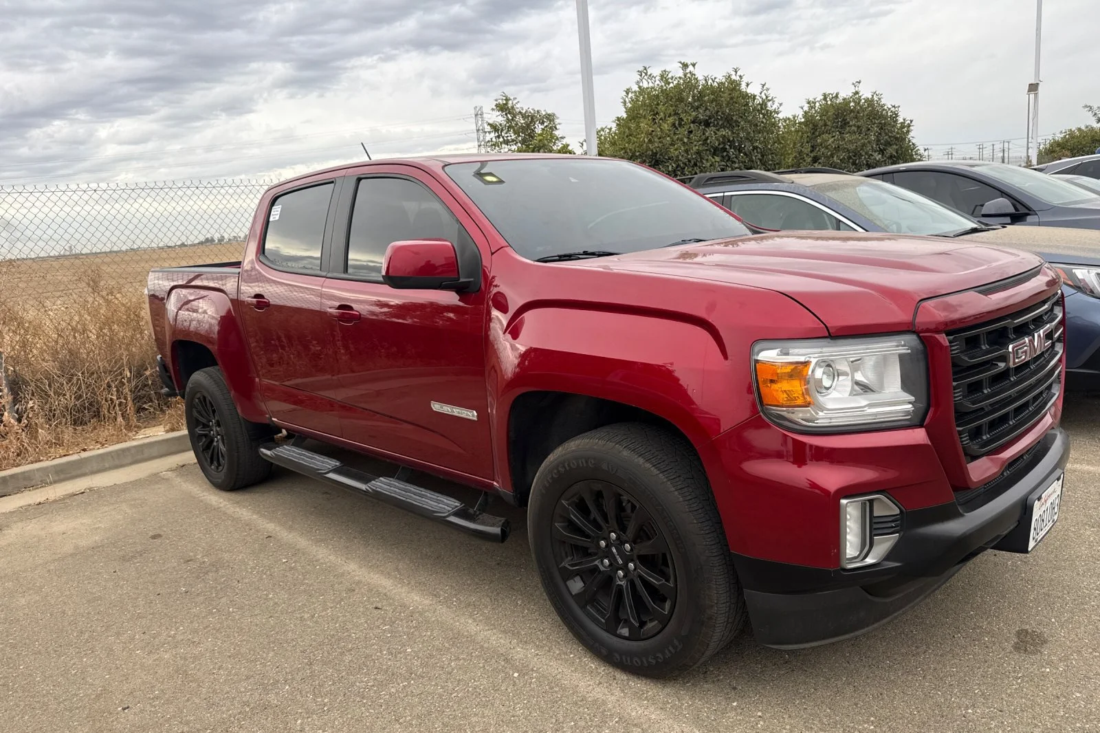 Used 2021 CAYENNE RED TINTCOAT GMC 2WD Elevation image 2