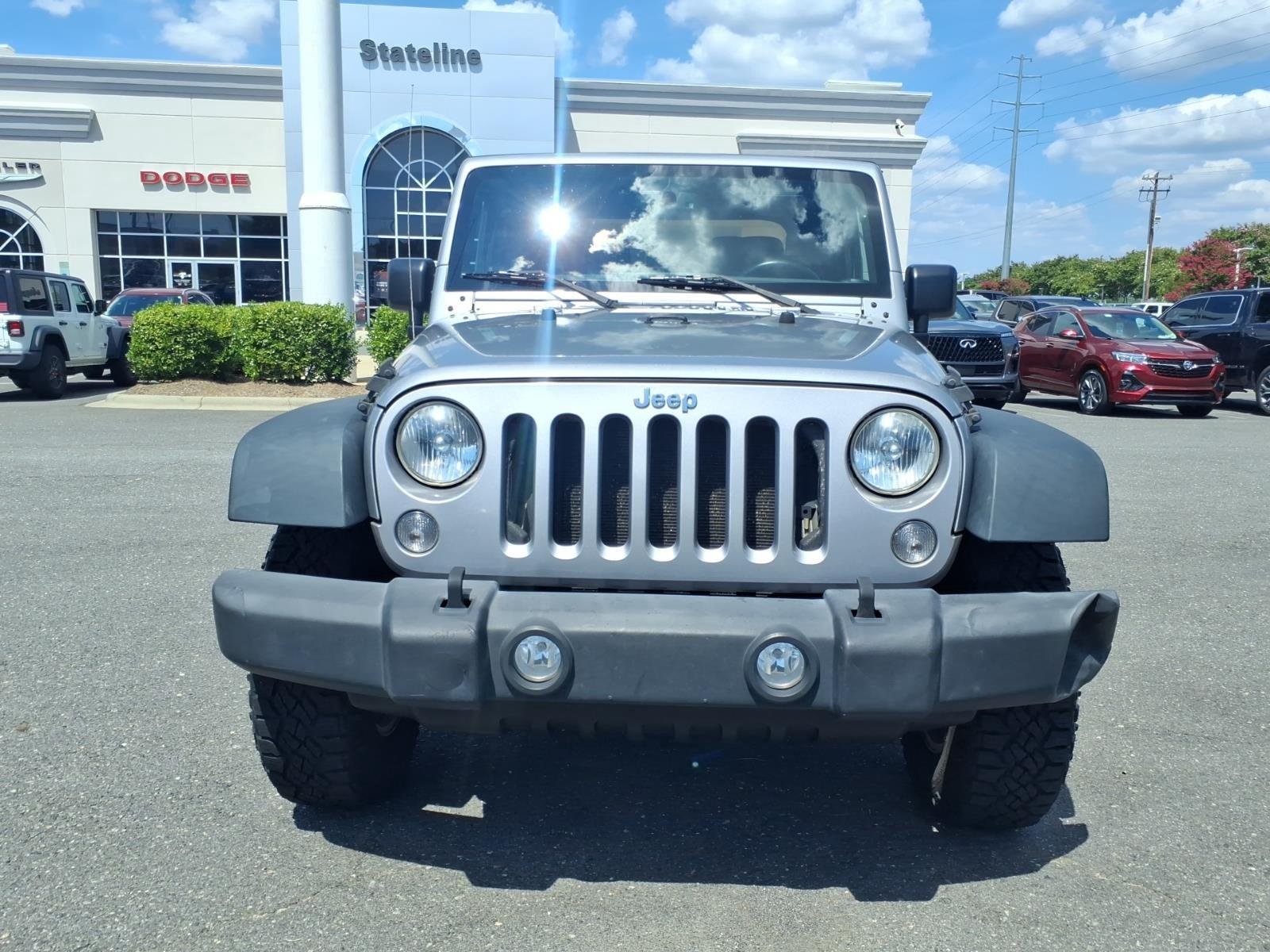 Used 2015 Billet Silver Metallic Clearcoat Jeep Sport image 12
