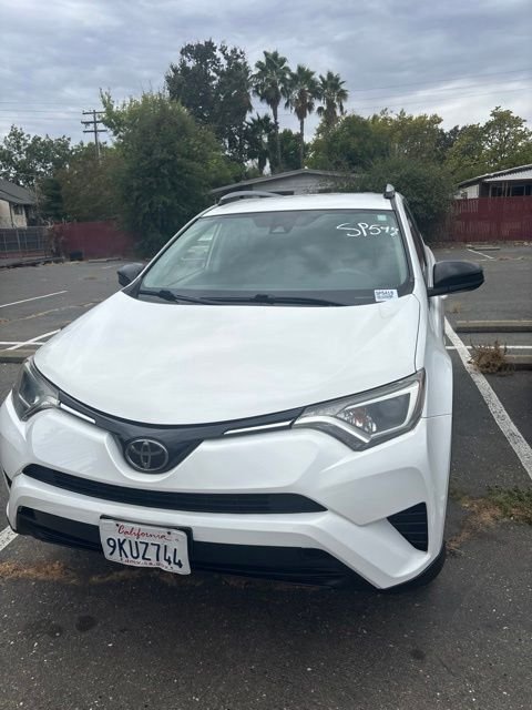 Used 2018 White Toyota LE image 1