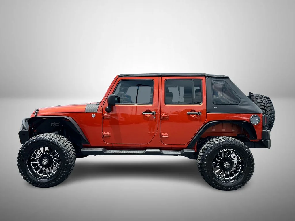 Used 2009 Orange Jeep Unlimited X image 6