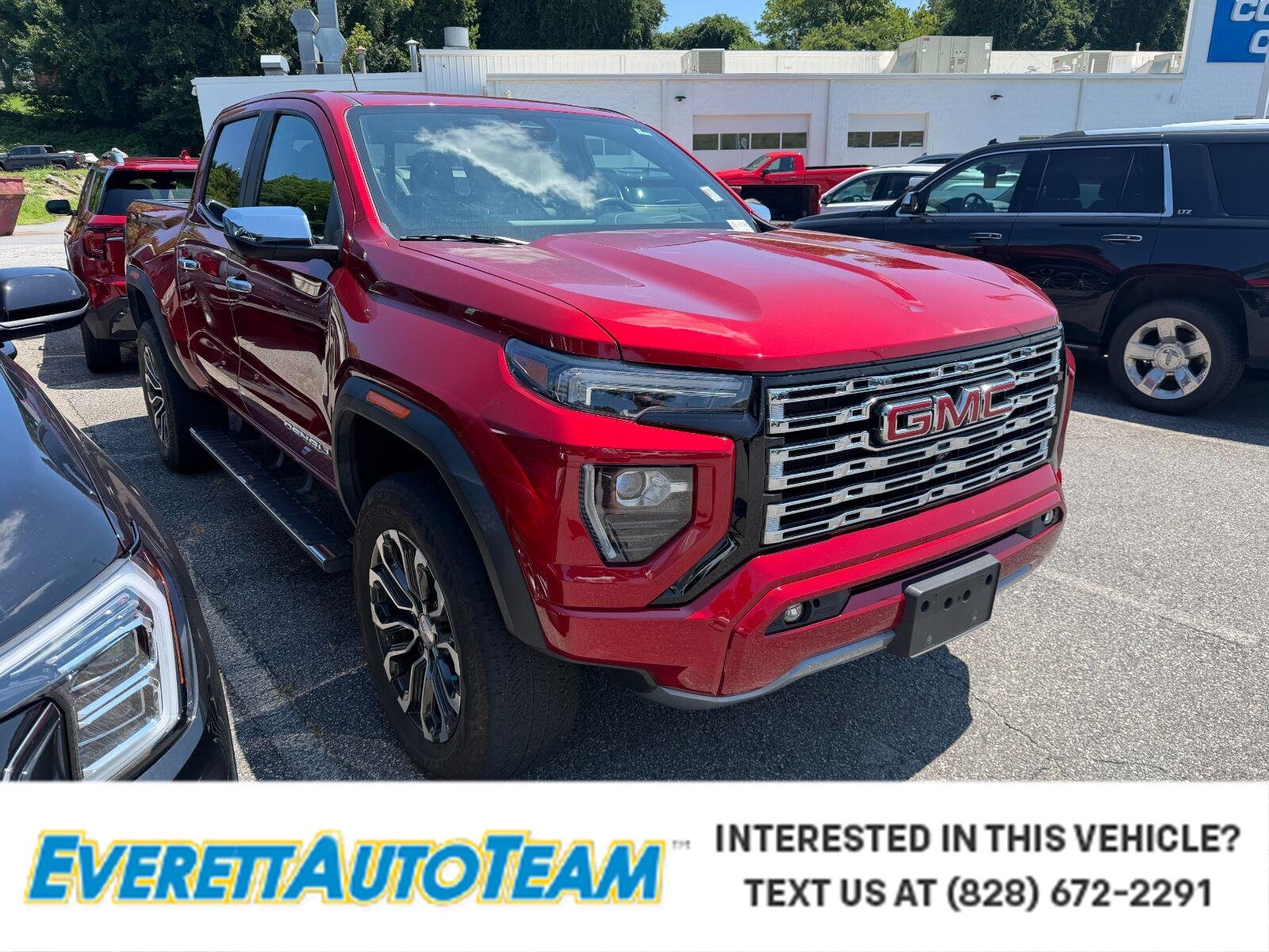 Used 2023 VOLCANIC RED TINTCOAT GMC 4WD Denali image 1
