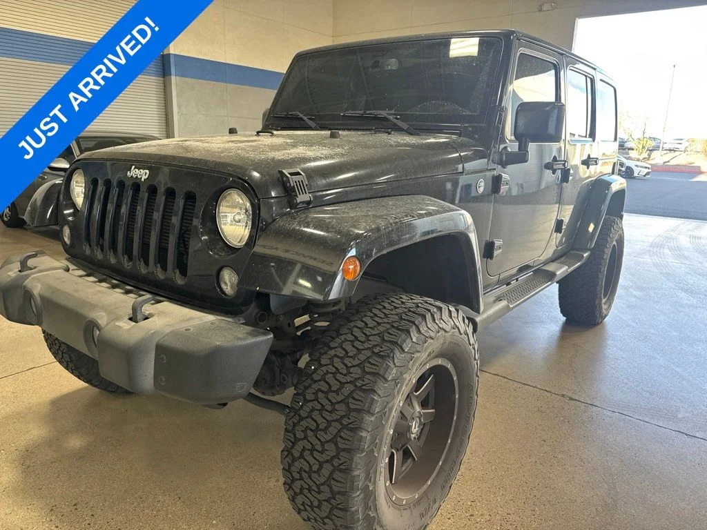 Used 2015 Black Clearcoat Jeep Unlimited Sahara image 1