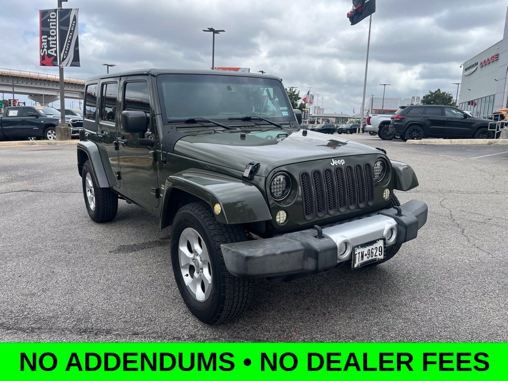 Used 2015 Green Jeep Unlimited Sahara image 1