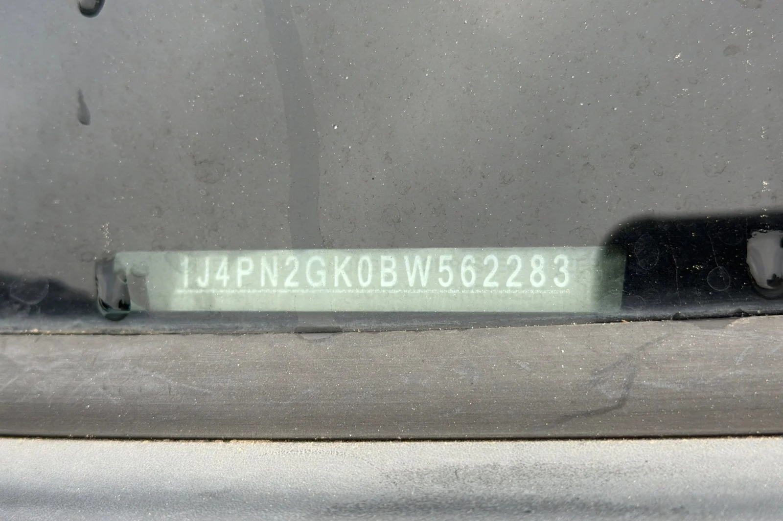 Used 2011 Bright Silver Metallic Jeep Sport image 3