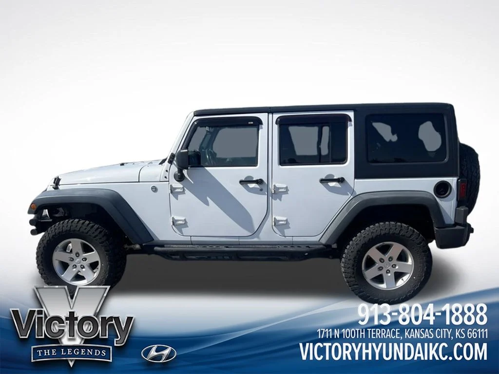 Used 2013 White Jeep Unlimited Sport image 8