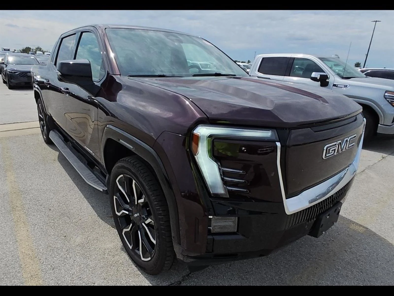 Used 2025 Dark Ember Tintcoat GMC Max Range Denali image 1