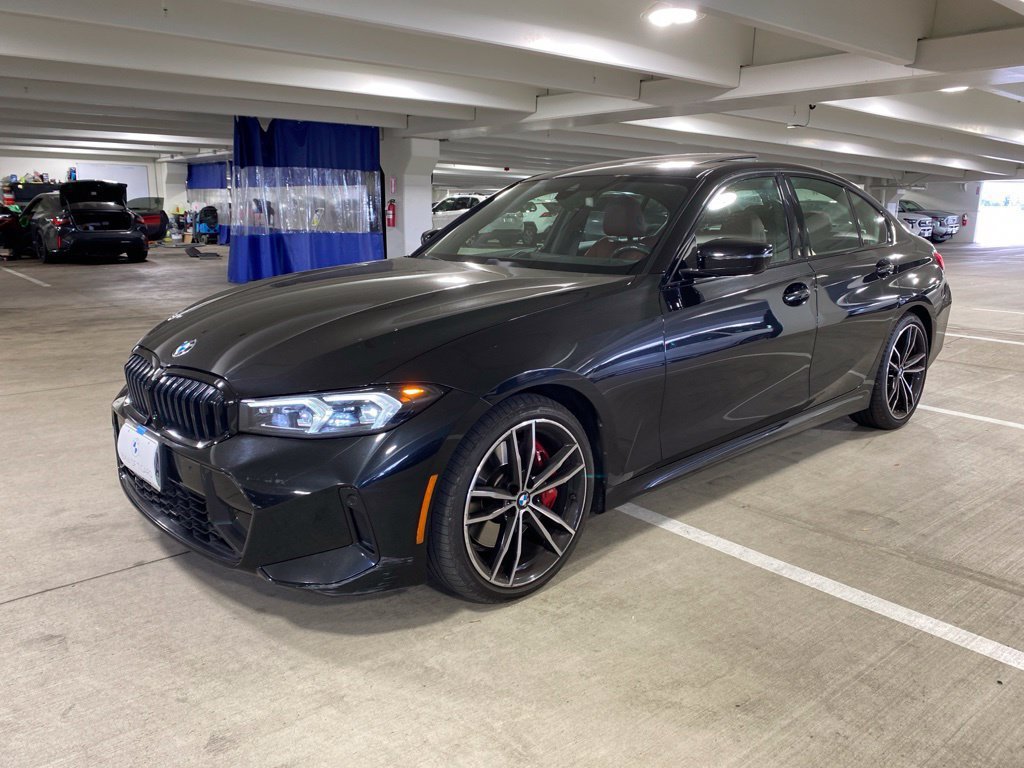 Used 2023 Black Sapphire Metallic BMW 330i xDrive image 1