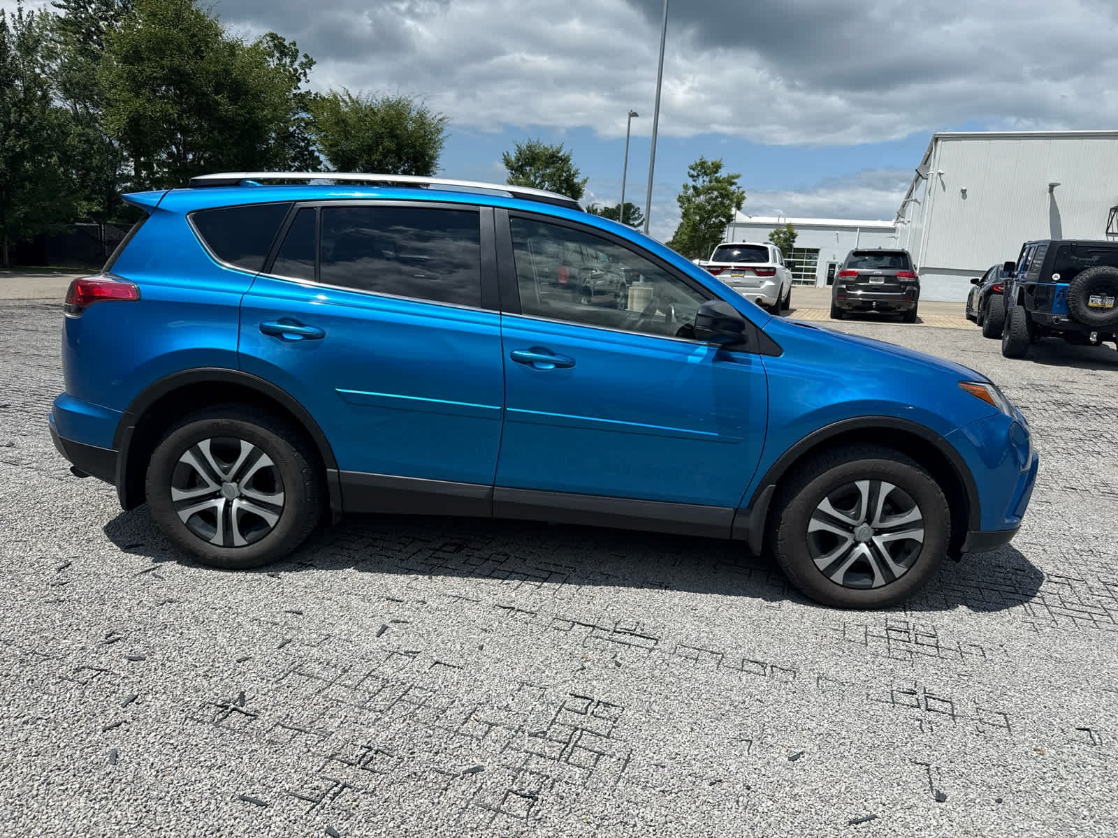 Used 2018 Electric Storm Blue Toyota LE image 4