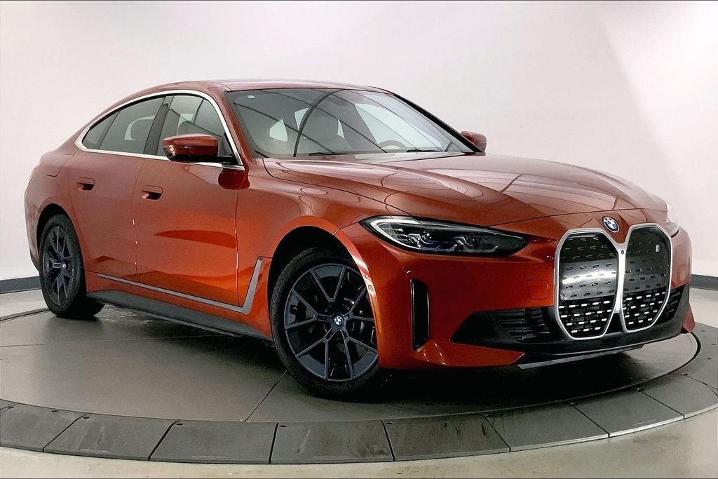 Used 2023 Sunset Orange Metallic BMW  image 1