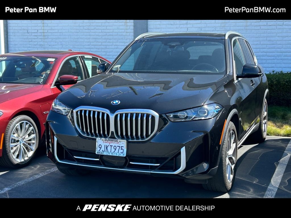 Certified Used 2024 Black Sapphire Metallic BMW xDrive50e image 1