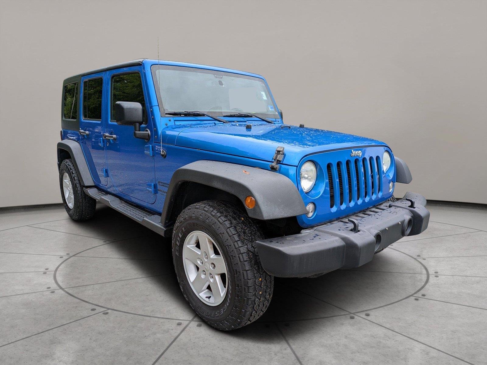 Used 2015 Hydro Blue Pearl Coat Jeep Sport image 1