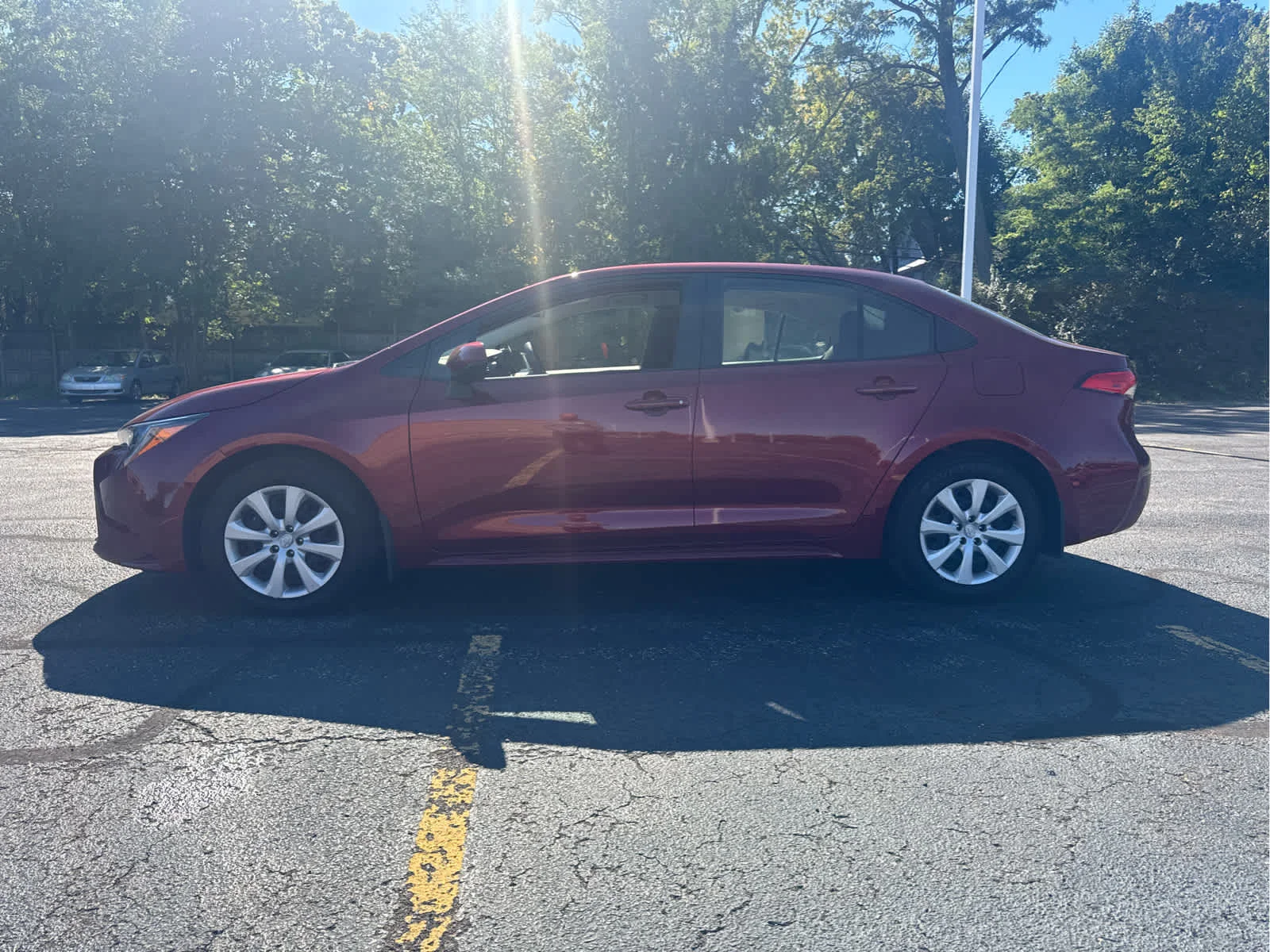 Used 2024 Ruby Flare Pearl Toyota LE image 2