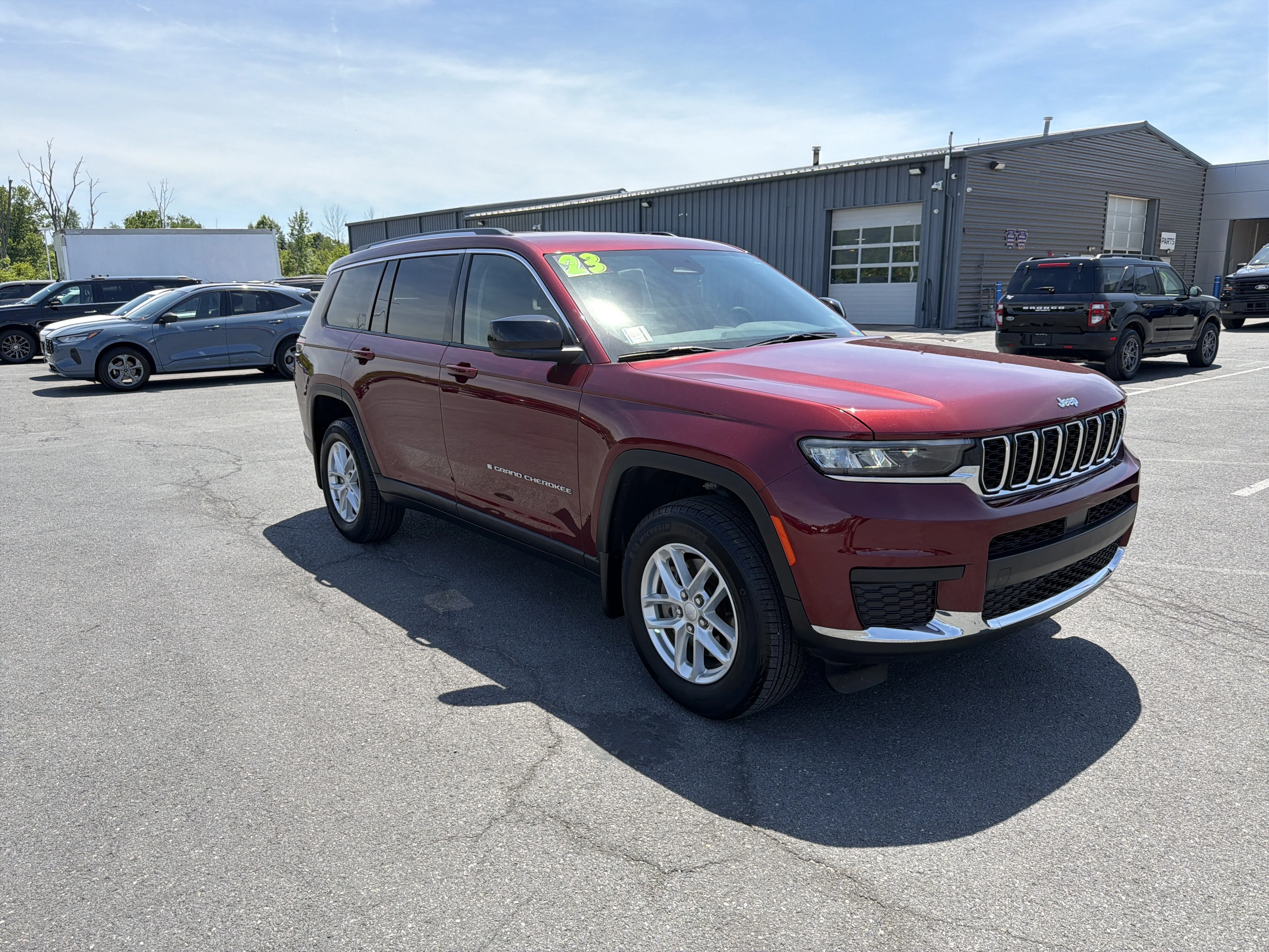 Used 2023 Velvet Red Pearlcoat Jeep Laredo image 1