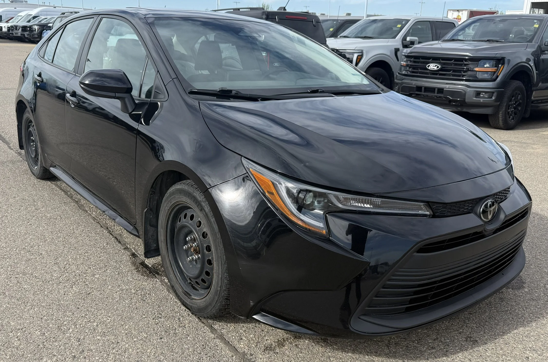 Used 2023 BLACK Toyota LE image 1