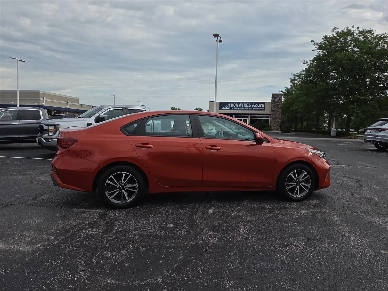 Used 2023 Fire Orange Kia LXS image 30