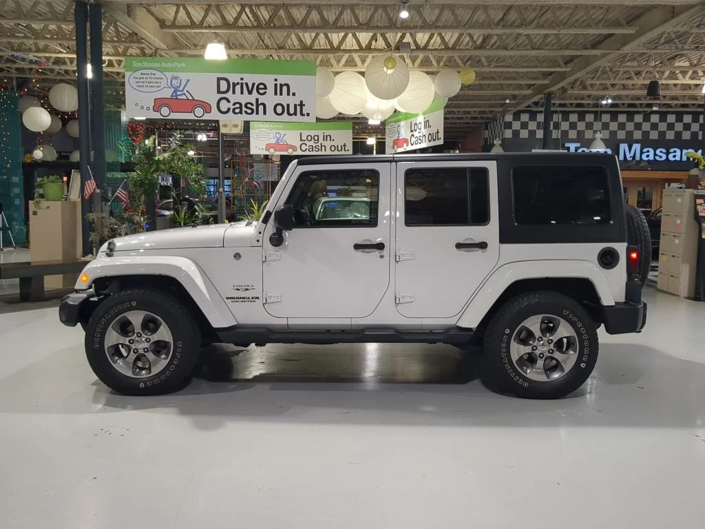 Used 2016 White Jeep Unlimited Sahara image 12