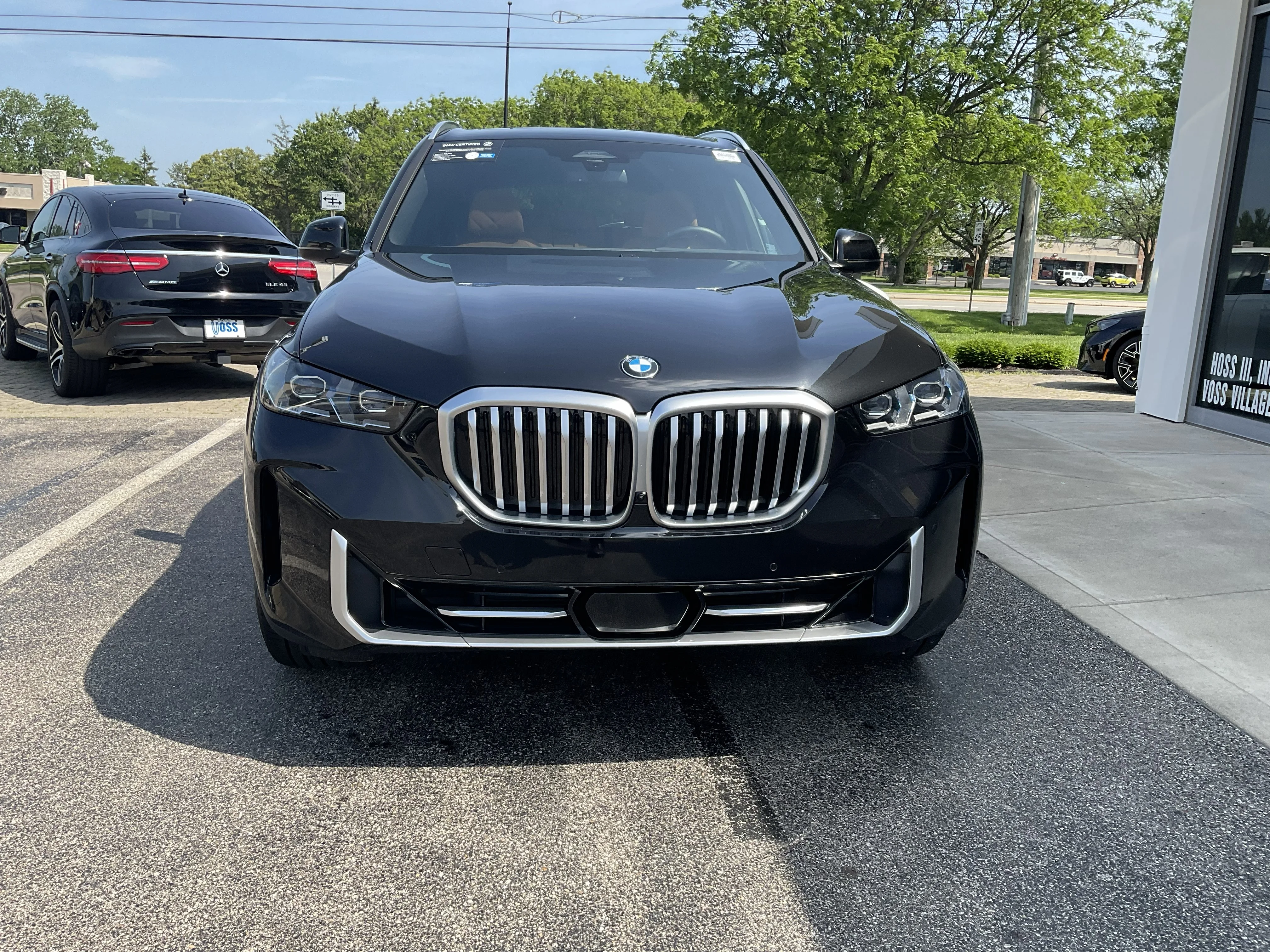 Certified Used 2024 Black Sapphire Metallic BMW xDrive40i image 2