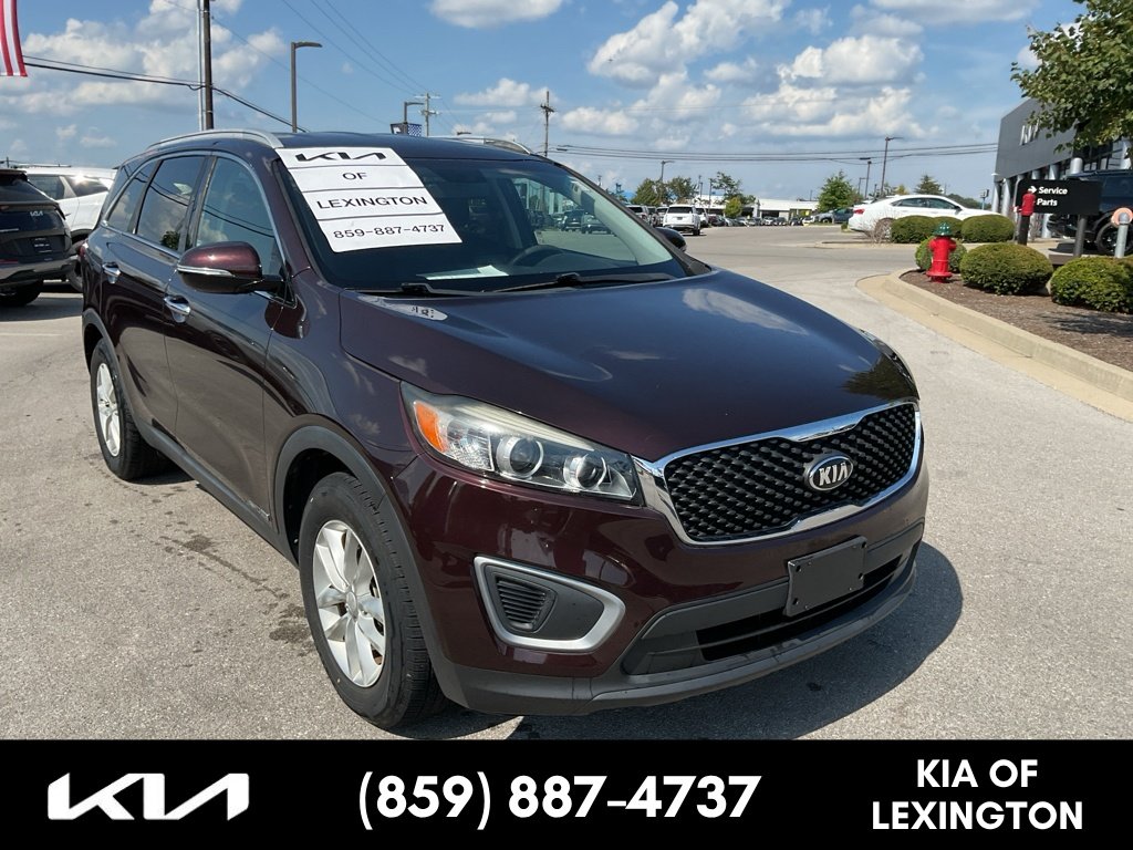 Used 2016 Dark Cherry Kia LX image 1