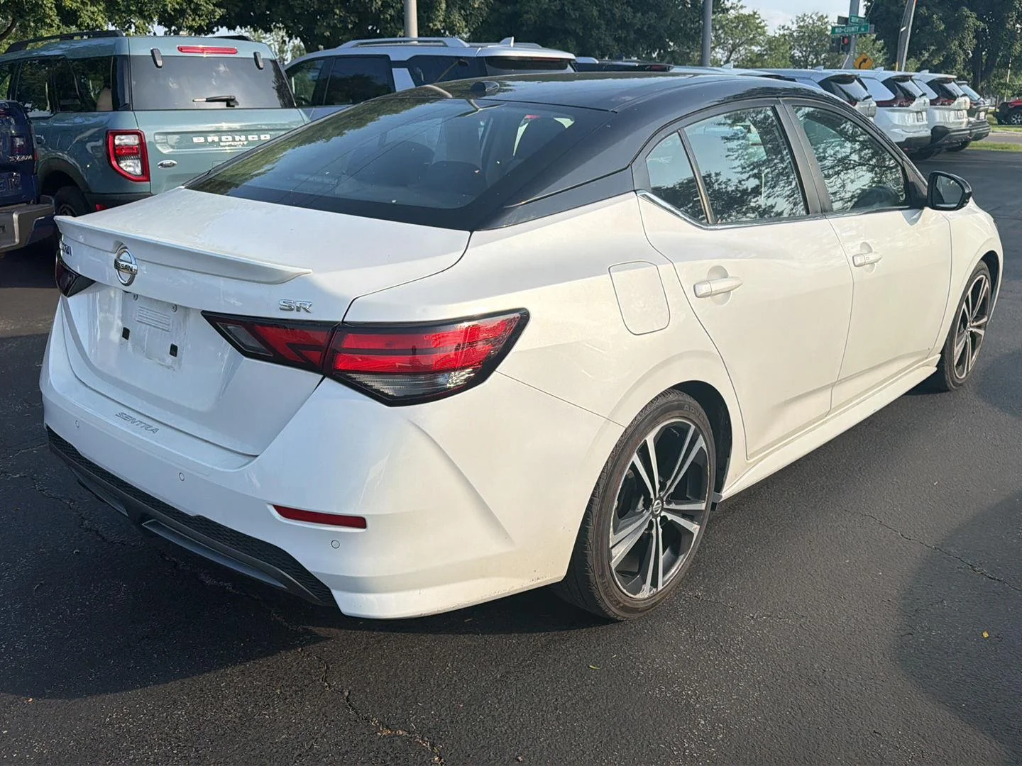 Used 2021 Aspen White/Super Black Nissan SR image 4