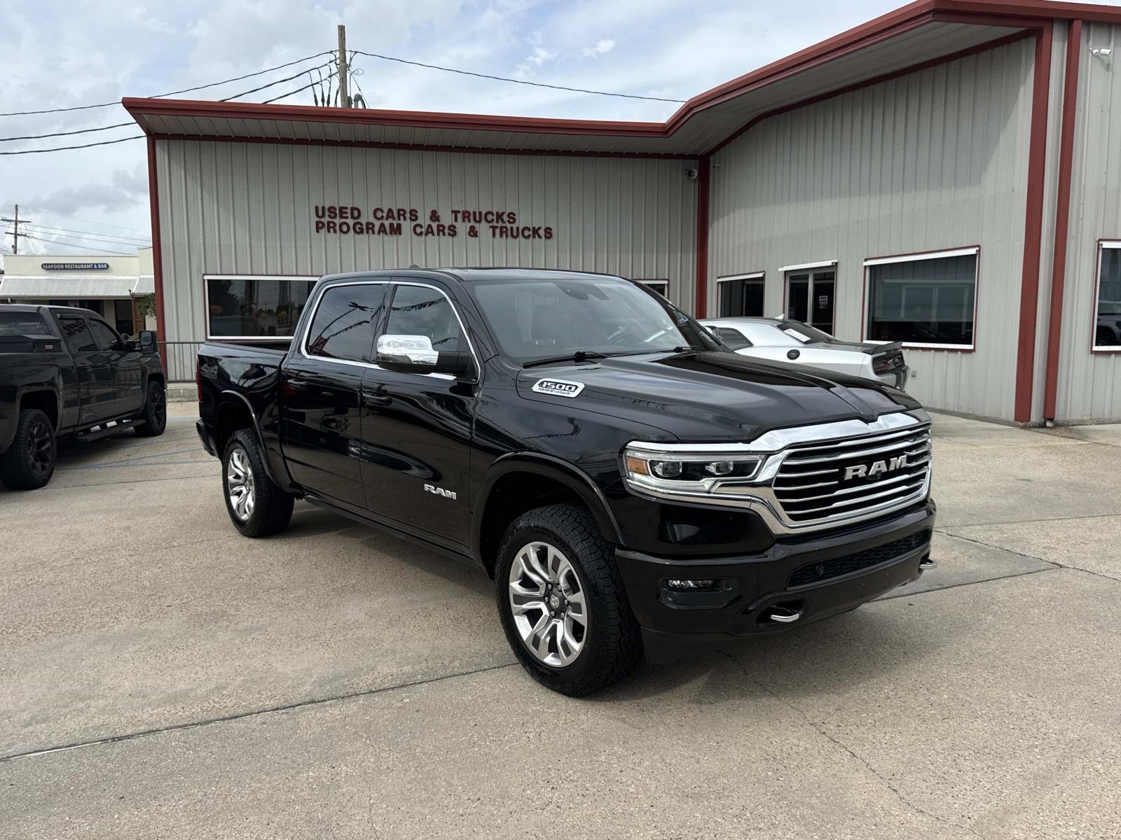 Used 2024 Diamond Black Crystal Pearlcoat Ram Longhorn image 1
