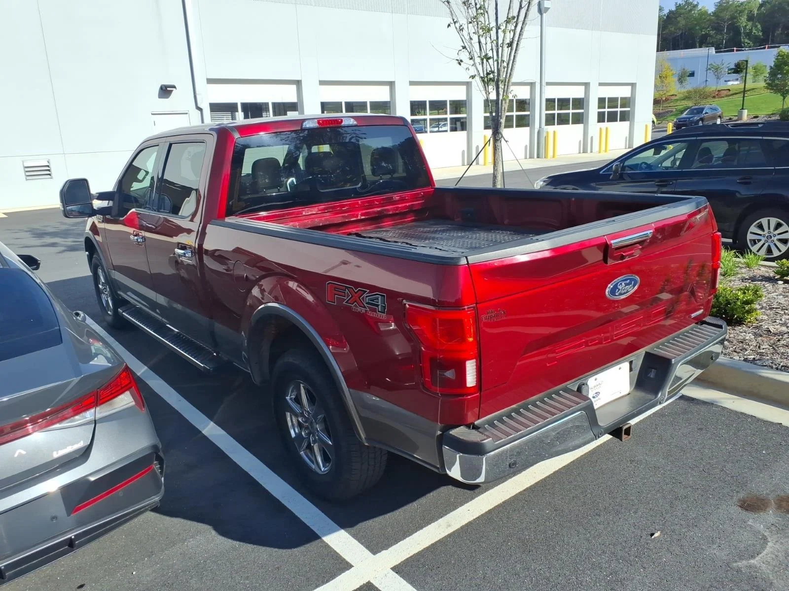 Used 2018 Ruby Red Metallic Tinted Clearcoat/Stone Gray Ford LARIAT image 6
