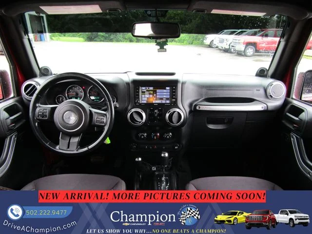 Used 2013 Red Jeep Unlimited Sahara image 9