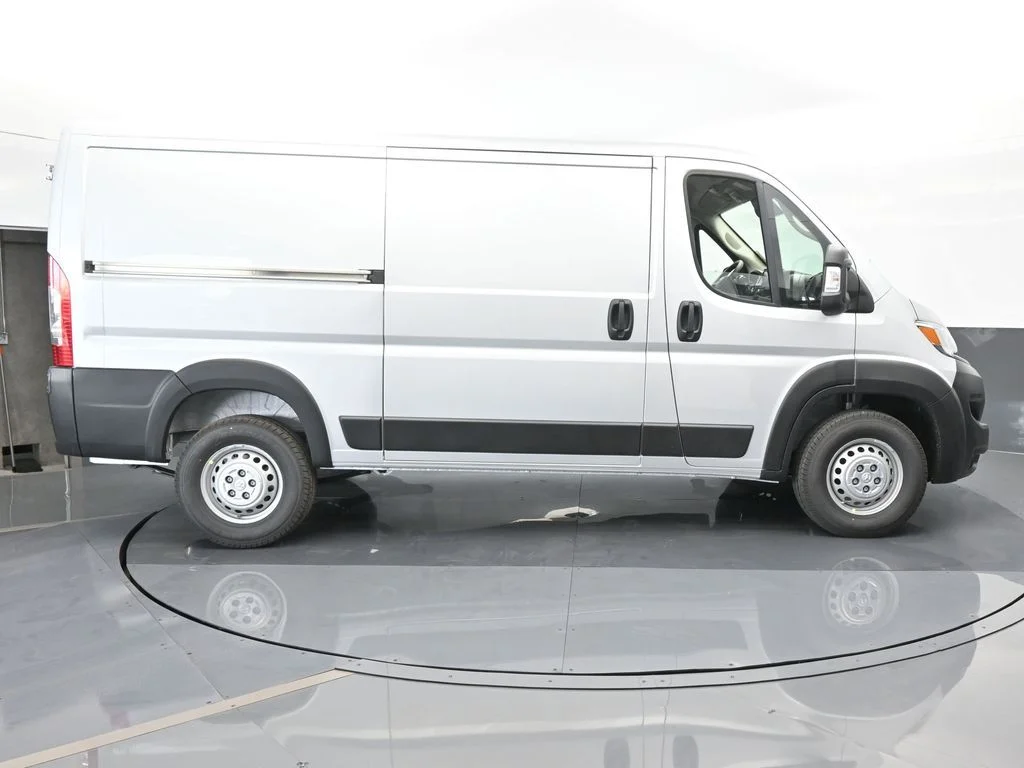Used 2025 Bright Silver Clearcoat Metallic Ram Low Roof image 7