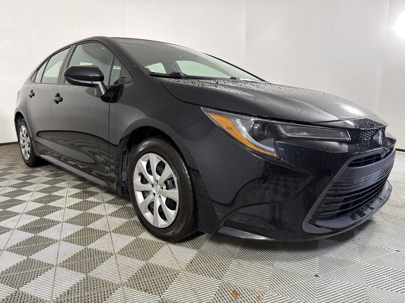 Used 2024 Midnight Black Metallic Toyota LE image 1