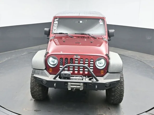 Used 2012 Red Jeep Unlimited Sport image 13