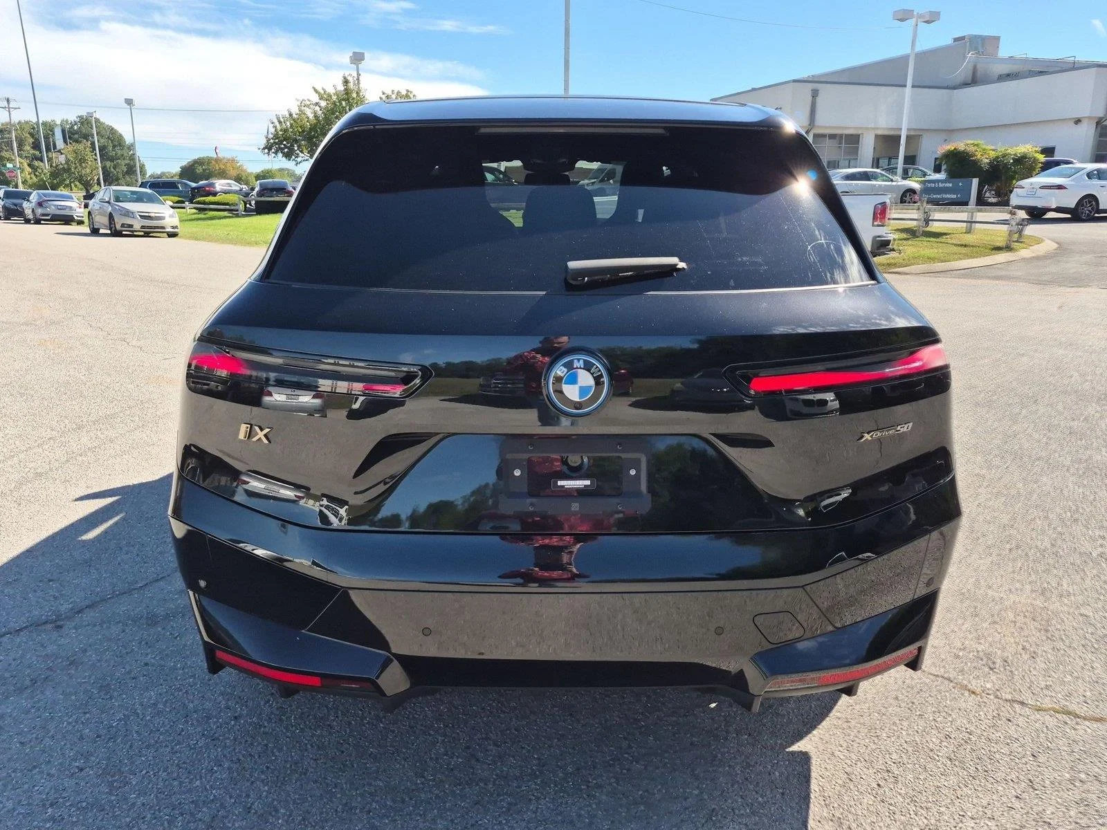 Used 2024 Black Sapphire Metallic BMW xDrive50 image 4
