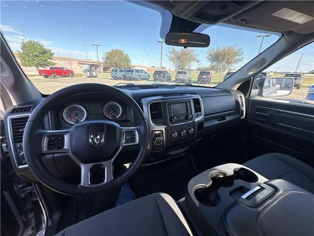 Used 2024 Granite Crystal Metallic Clearcoat RAM SLT 4x4 Quad Cab 6.3 ft. box 140 in. WB image 9