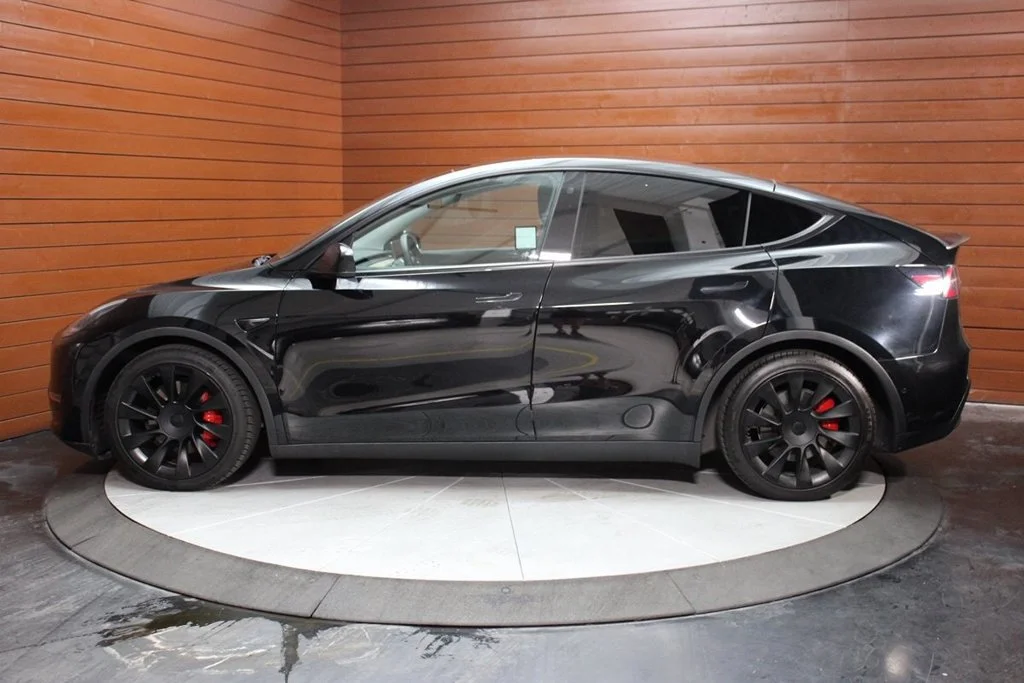 Used 2022 Solid Black Tesla Performance image 4