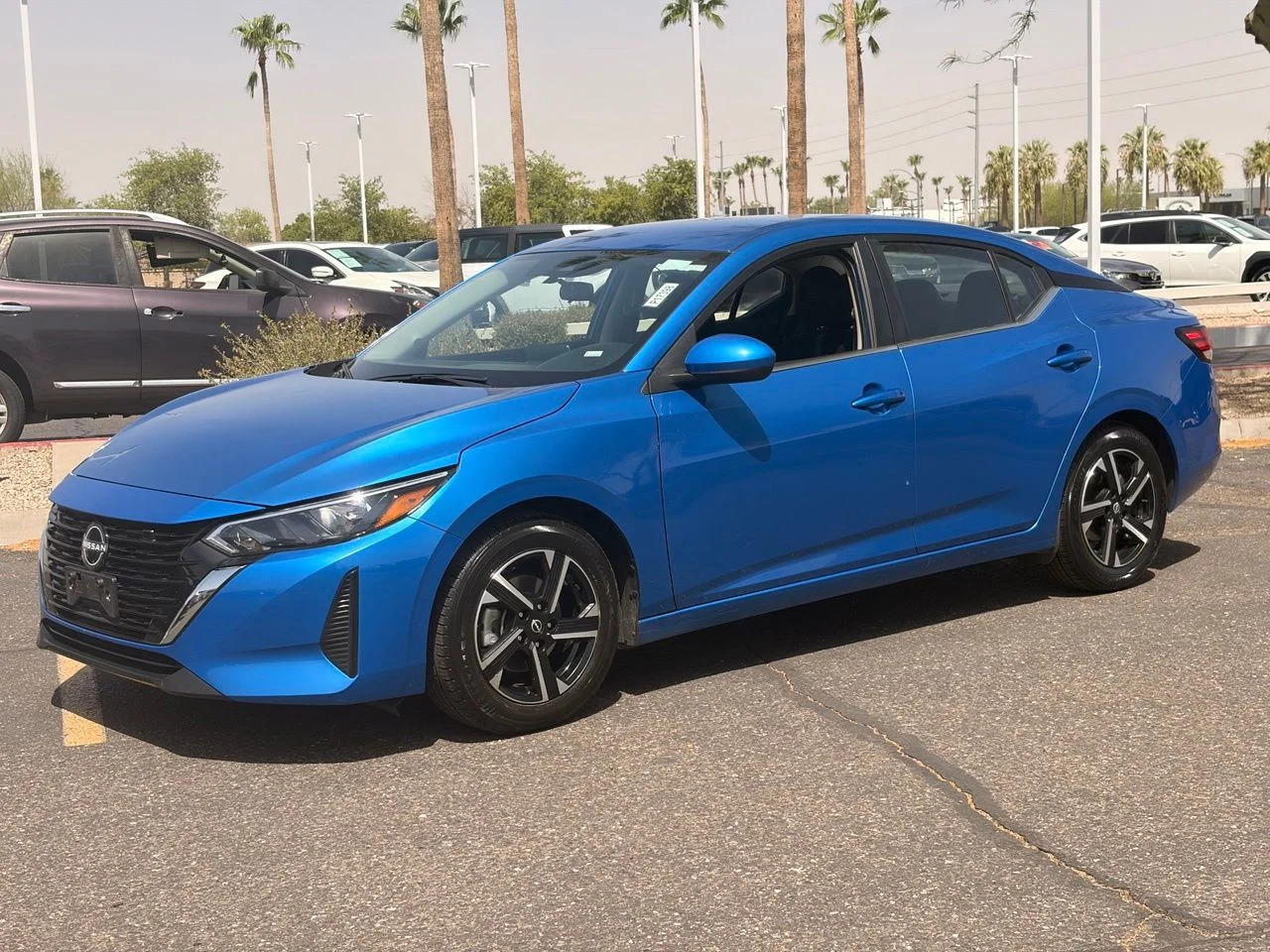 Used 2024 Electric Blue Metallic Nissan SV image 1