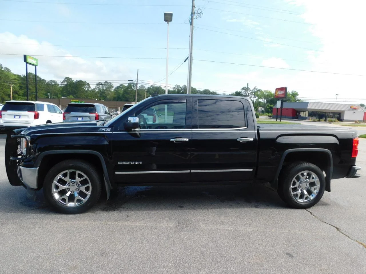Used 2014 Black GMC 4WD Crew Cab 143.5 in SLT image 5