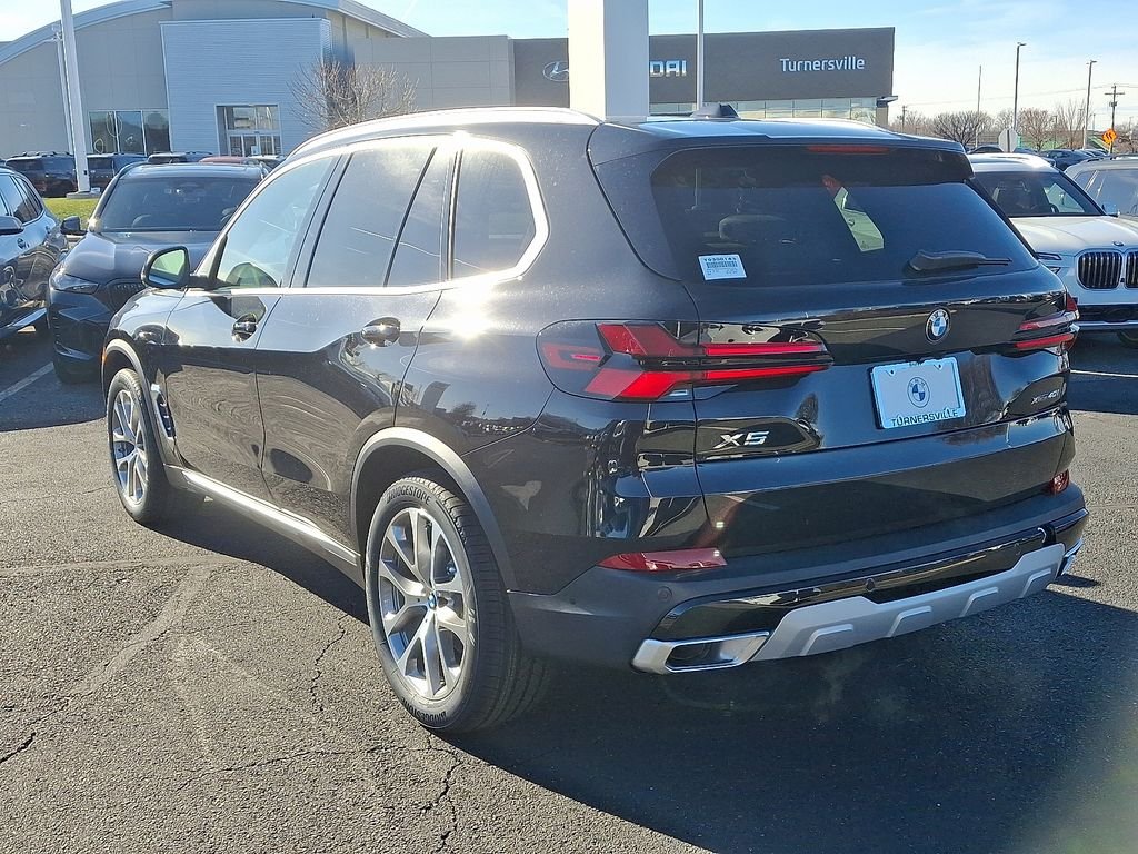 Certified Used 2026 Black Sapphire Metallic BMW xDrive40i image 3