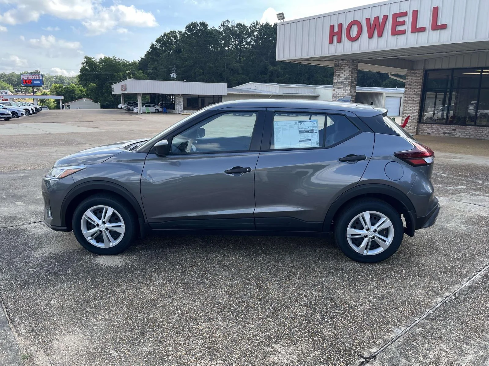 Used 2025 GUN METALLIC Nissan S FWD image 4