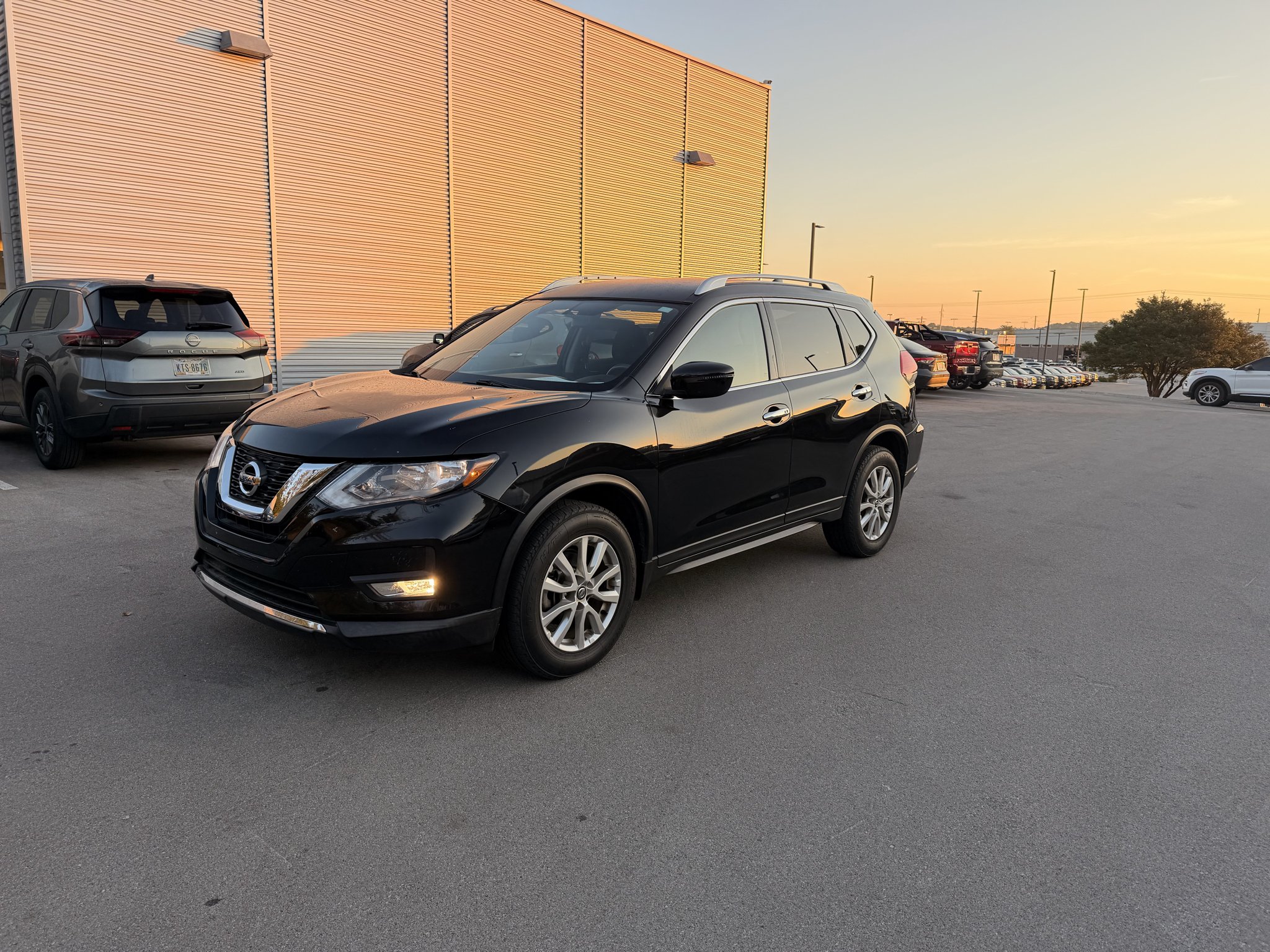 Certified Used 2017 Magnetic Black Nissan SV image 1