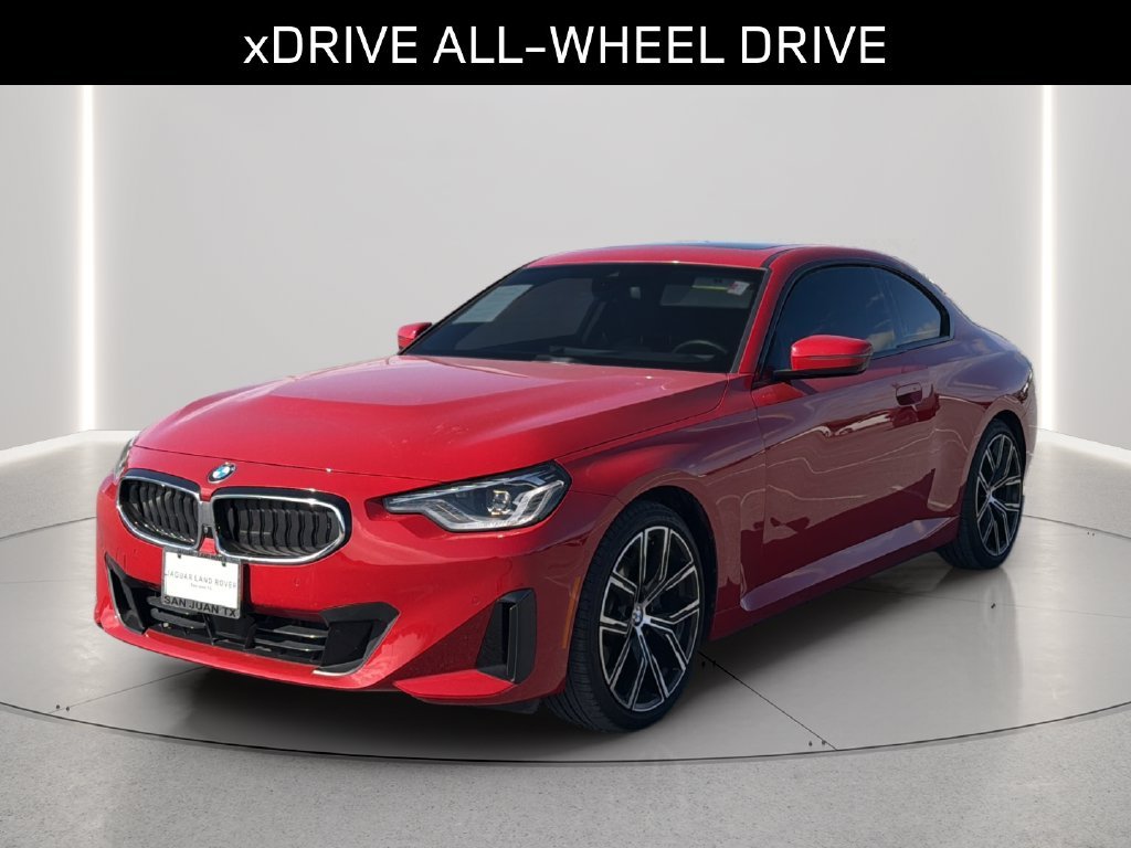 Used 2024 Melbourne Red Metallic BMW 230i xDrive image 1