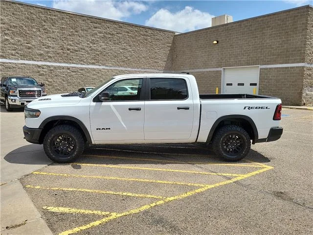Used 2025 Bright White Clearcoat RAM Rebel 4x4 Crew Cab 144.5 in. WB image 2