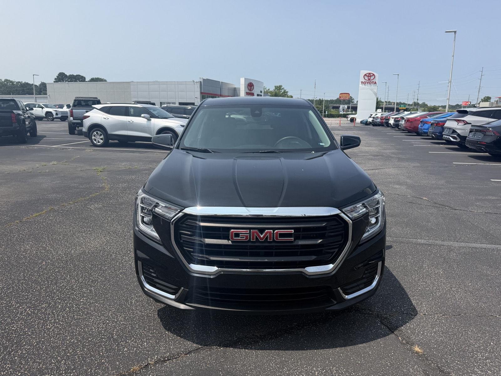 Used 2024 Ebony Twilight Metallic GMC SLE image 2