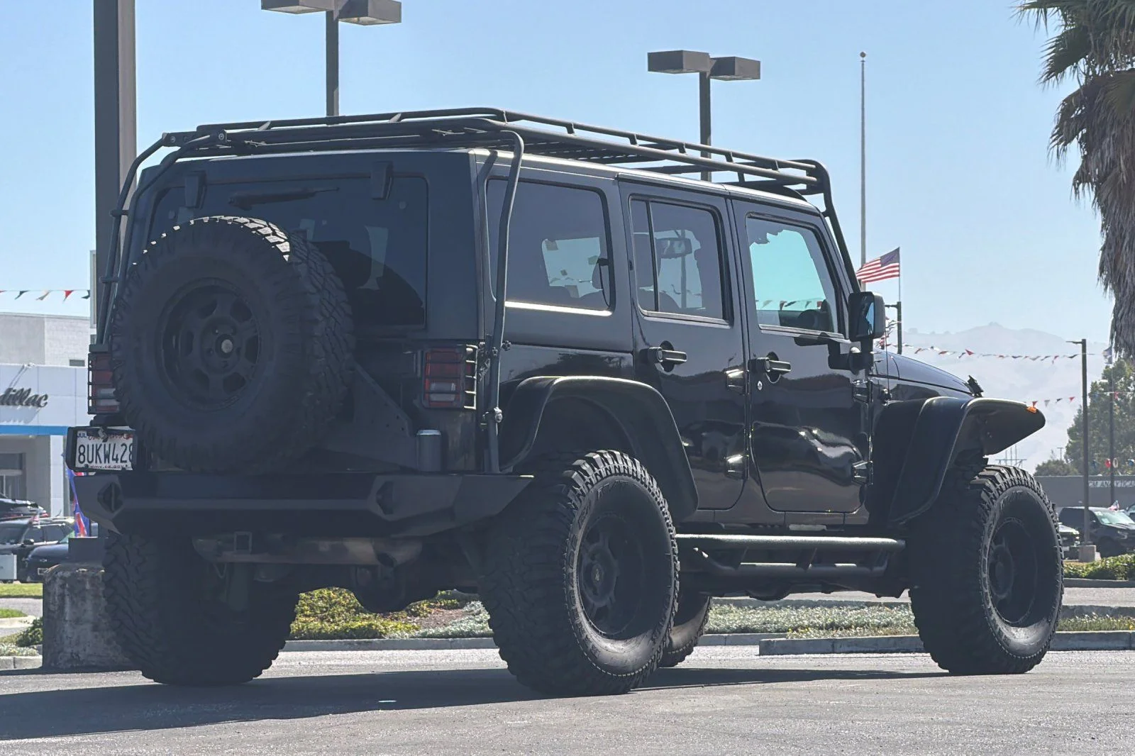 Used 2013 Black Jeep Unlimited Sport image 4
