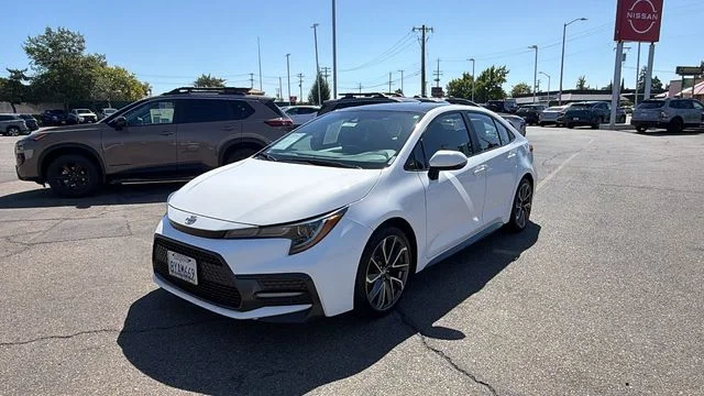 Used 2022 Black Sand Pearl Toyota SE image 1