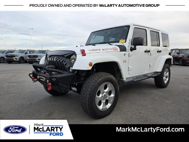 Used 2014 White Jeep Unlimited Sahara image 1
