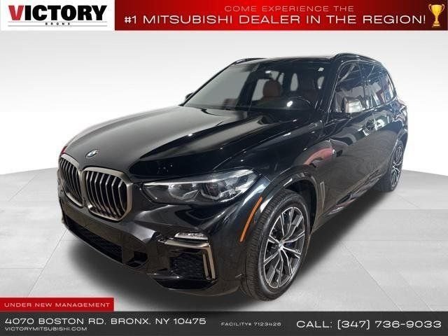 Used 2021 Black BMW M50i image 1