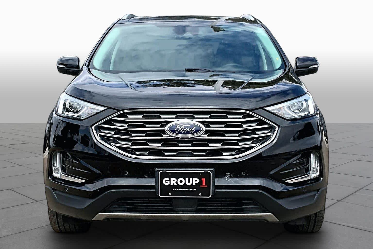 Used 2022 Agate Black Metallic Ford Titanium image 4