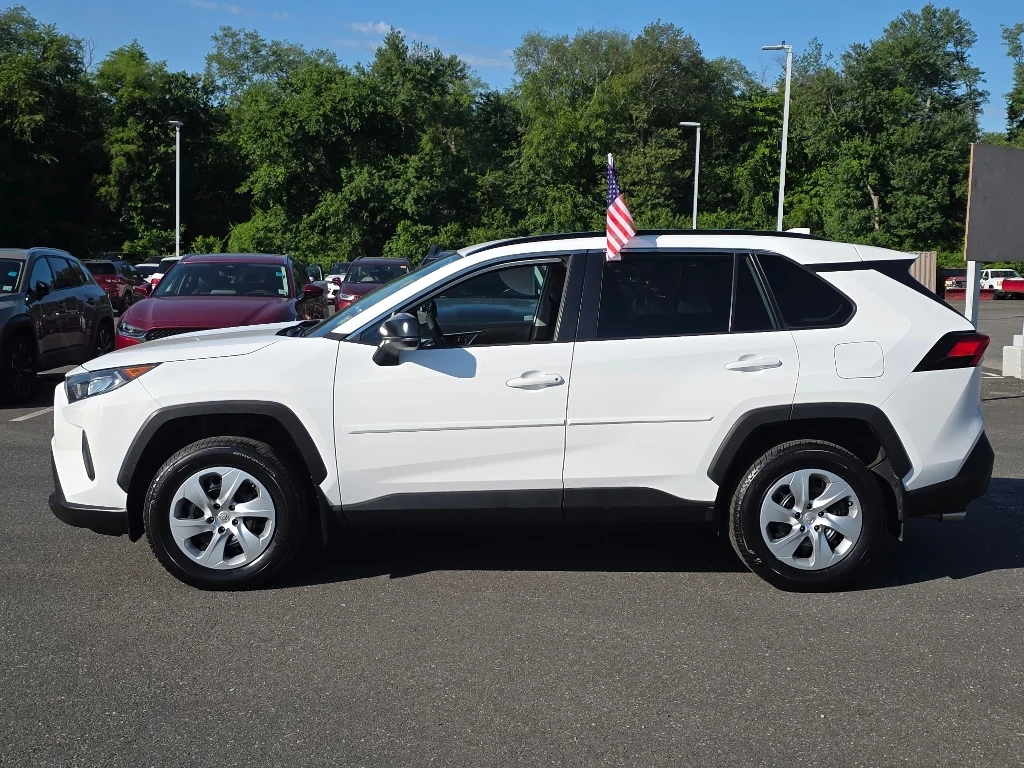 Used 2021 Super White Toyota LE image 12