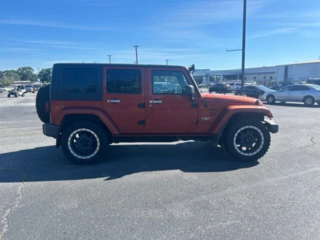 Used 2009 Orange Jeep Unlimited Sahara image 5